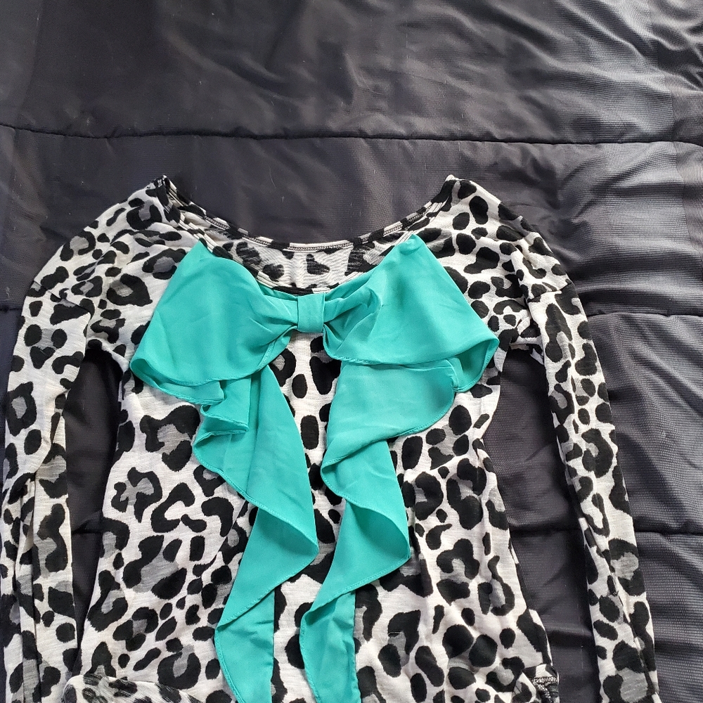 Large gray black animal print long sleeve, turquoise bow accent on back